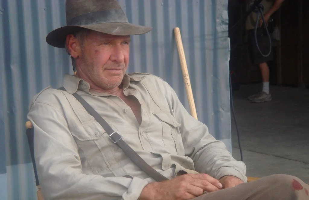 An exhausted conference attendee sitting in a chair